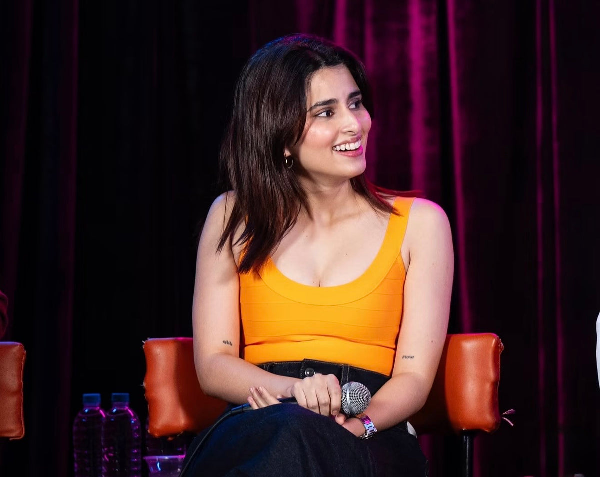 Actress Aisha Ahmed on Relationshit Advice by Raunaq Rajani wearing the Cindy orange bandage top by Casual Threat