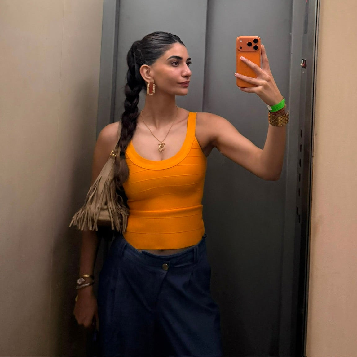 Ashna Suri wearing Casual Threat Cindy orange bandage top