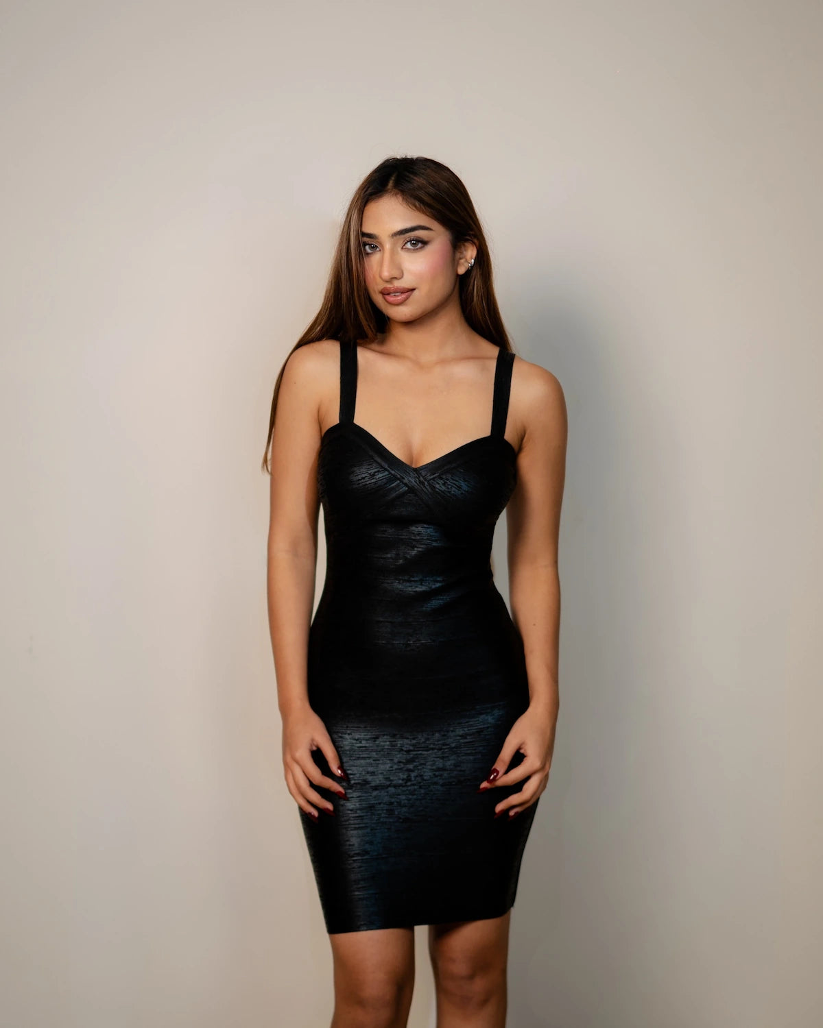 Gurman Dahelay in the Samantha black sweetheart neckline bandage dress by Casual Threat, front view