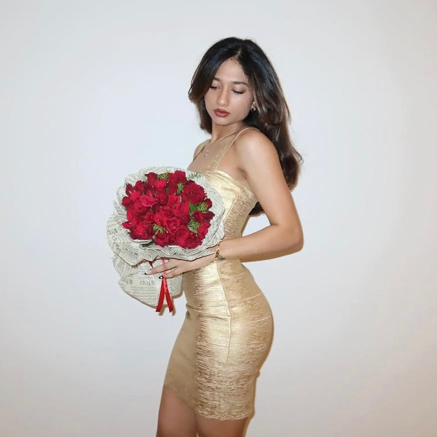 Influencer wearing Naomi gold metallic bandage dress by Casual Threat — sculpted bodycon fit with body contouring silhouette