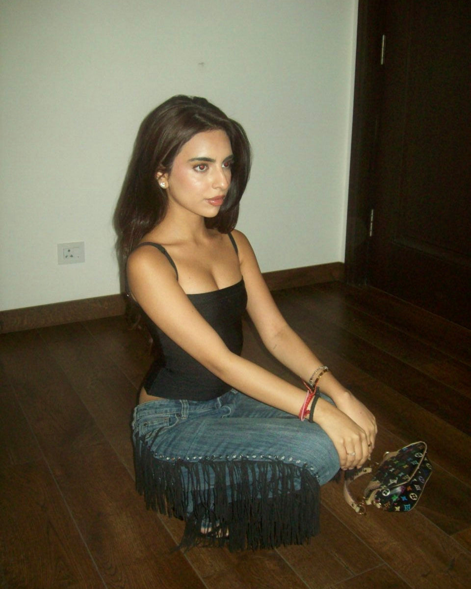 Siya Bhasin wearing the Casual Threat Kate black bandage tank top with thin straps, styled for a night out